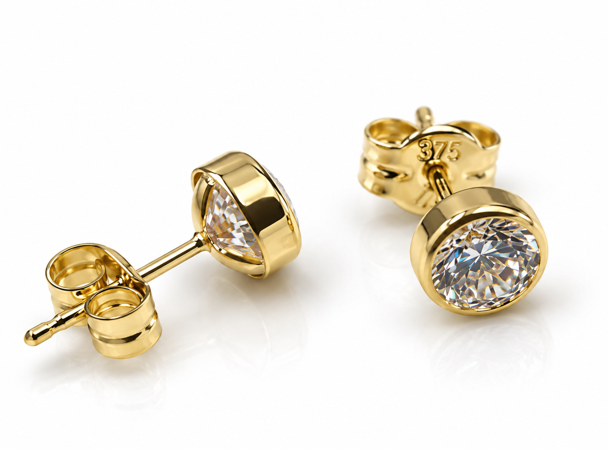 Round yellow gold stud earrings with clear stones and butterfly backs on a white background