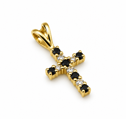 Close-up of small 9ct yellow gold sapphire and diamond cross pendant