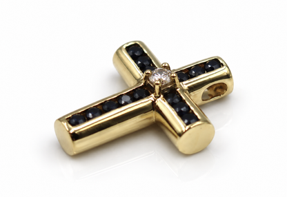 Angled view of sapphire and diamond gold cross pendant showing side bail opening
