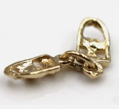 Reverse view of yellow gold theatre masks pendant charm and attachment ring