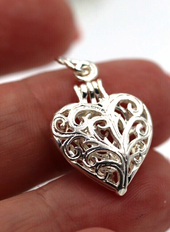 Silver filigree heart online locket