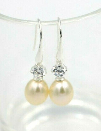 Sterling Silver 925 Oval Freshwater Cultured Pearl with 4-Claw 5mm Natural White CZ Hook Earrings