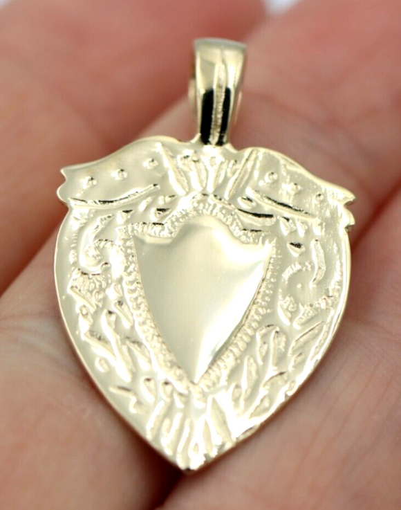 Gold shield pendant deals